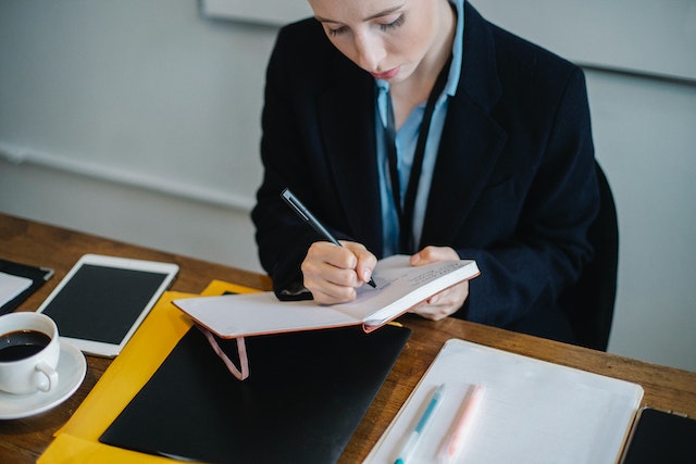 professional property manager writing on notepad